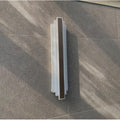 Slim Brass-Tone Cylinder Wall Sconce interior photograph 1